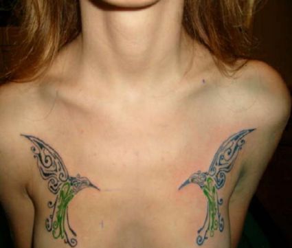 Tribal Bird Pic Tattoo On Chest